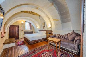 Postel nebo postele na pokoji v ubytování MDC Cave Hotel