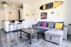 a living room with a couch and a table at Terrazas del Sur in Los Abrigos