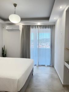 Ένα ή περισσότερα κρεβάτια σε δωμάτιο στο BJ House