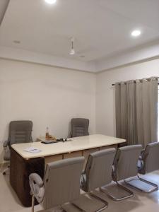 a conference room with a table and chairs at Park Avenue in Ludhiana