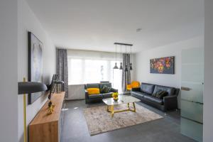 a living room with a couch and a table at Klever Ausblick in Kleve