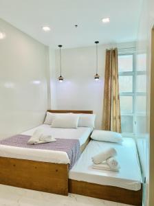 Ένα ή περισσότερα κρεβάτια σε δωμάτιο στο Casa Ysabel Transient Inn