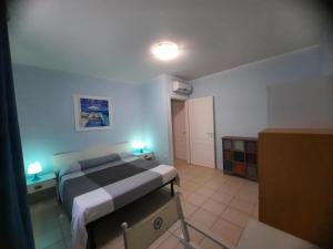 a bedroom with a bed in a room at Pergola n.3 in Cavo +13 photos