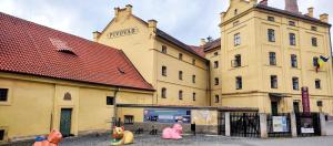 a group of plastic toys in front of a building at Ubytovani Sarka in Čistá