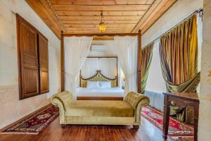 Postel nebo postele na pokoji v ubytování MDC Cave Hotel