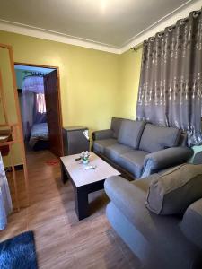 Posezení v ubytování Muni Residences Ug