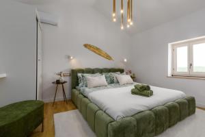 Ένα ή περισσότερα κρεβάτια σε δωμάτιο στο Casa Riccardo Funtana