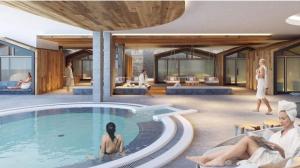 two women sitting in a swimming pool in a house at Studio 4103 Les Sources aux Bains d'Ovronnaz in Ovronnaz +15 photos