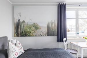 Postel nebo postele na pokoji v ubytování Ferienwohnung "Ostseeblick"