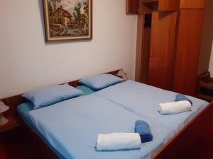 Postel nebo postele na pokoji v ubytování Apartma Karmen