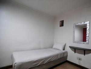 Ein Bett oder Betten in einem Zimmer der Unterkunft Hotel China Town 2