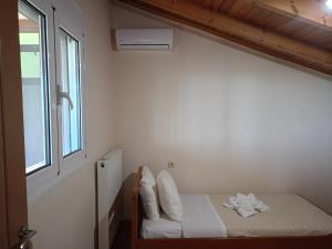 A bed or beds in a room at Villa Areti - A Cottage in the Cretan Nature