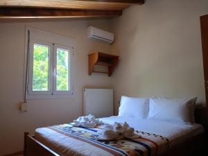 A bed or beds in a room at Villa Areti - A Cottage in the Cretan Nature