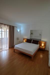 Postel nebo postele na pokoji v ubytování Casa TIANA