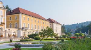 a large building with a fountain in front of it at Grand Hotel Rogaska in Rogaška Slatina
