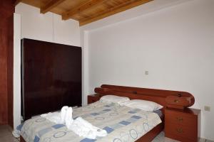 A bed or beds in a room at Villa Areti - A Cottage in the Cretan Nature