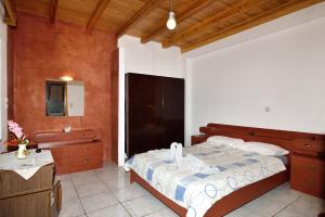 A bed or beds in a room at Villa Areti - A Cottage in the Cretan Nature