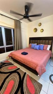 Ένα ή περισσότερα κρεβάτια σε δωμάτιο στο Humble Homestay Putrajaya