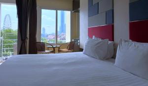 Ένα ή περισσότερα κρεβάτια σε δωμάτιο στο The Sunreno Hotel Bangkok +18 φωτογραφίες