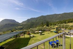 a balcony with a view of the mountains at Apartments in Tremosine - Gardasee 22254 in Pieve +6 photos
