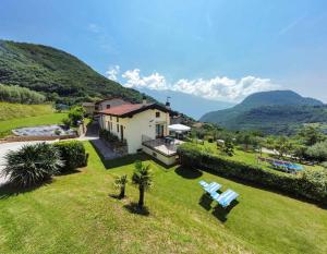 an aerial view of a house with mountains in the background at Apartments in Tremosine - Gardasee 22254 in Pieve