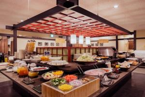 a buffet line with many different types of food at HOTEL MYSTAYS PREMIER Kanazawa in Kanazawa