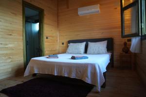 Postel nebo postele na pokoji v ubytování Lake Wood House