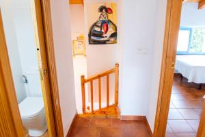 a bathroom with a toilet and a stairway at Casa Pedroso in Noja +53 photos