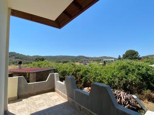 a view from the balcony of a house at Aphrodites Gardens in Ormos Panagias