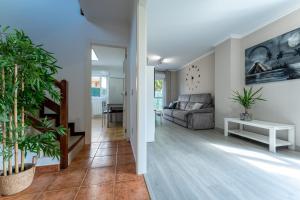 a living room with a couch and a table at Casa San Martin in Cortiguera