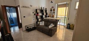 a living room with a couch and a table at Domus Caieta in Gaeta