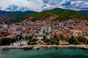 an aerial view of a city next to the water at Apartament Lola in Pogradec