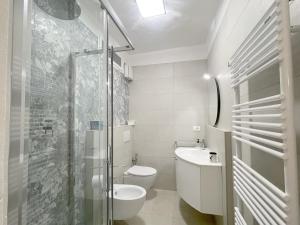 a bathroom with a shower and a toilet and a sink at La Loggia near Piazza del Campo in Siena +21 photos