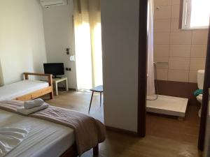 Photo de la galerie de l'établissement Molos Beach Rooms, à Kíssamos