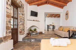 a living room with a couch and a table at SeaView Apartment 4 in Psilí Ámmos