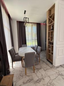 a dining room with a table and chairs at Aurum Villas Smokinya Beach in Sozopol