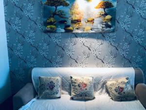 En eller flere senge i et værelse på ThanhTam homestay