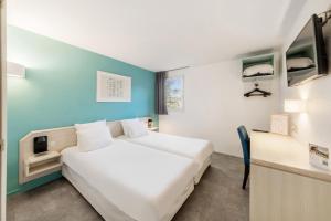 Voodi või voodid majutusasutuse Comfort Hotel Orleans Saran toas