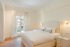 Posteľ alebo postele v izbe v ubytovaní Etoile Luxury Suites