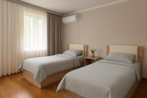 Postel nebo postele na pokoji v ubytování SEDEP Guesthouse