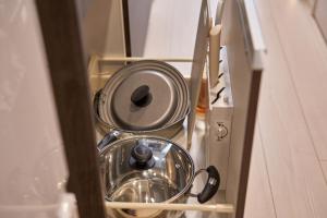 a metal bowl in a drawer in a cabinet at Yamanote Line walk for 5 min, new modern APT on local shopping street in Tokyo
