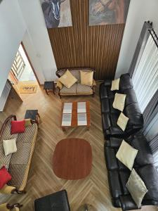 an overhead view of a living room with a leather couch at Naivasha Moi Southlake Villas in Naivasha