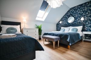 Ένα ή περισσότερα κρεβάτια σε δωμάτιο στο Great Holidays