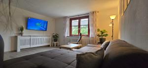 TV a/nebo společenská místnost v ubytování Wellness Apartment