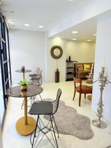 a living room with chairs and a table at Wame Suite Hotel Nisantasi in Istanbul +131 photos