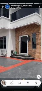 a picture of a building with a sign in front of it at Joak realty investment in Mama