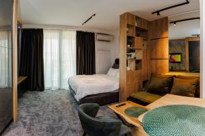 Ένα ή περισσότερα κρεβάτια σε δωμάτιο στο Grey Nest - Luxury Studio Apartment in Planet Residence, Niš