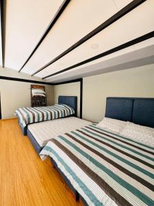 two beds sitting in a room with at Glamping Desierto Santa María 2 in Villa de Leyva