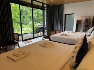 Cosy Garden Khao Sok客房内的一张或多张床位