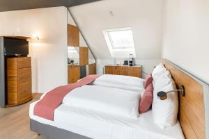 Voodi või voodid majutusasutuse Tailormade Hotel KRONE Sarnen toas